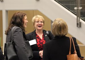 Chief Justice Lori Gildea laughs with community members