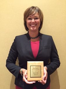 Kate Fogarty poses with the NACM Award.
