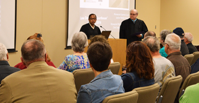 Justice Hudson and Chief Judge Walker speak to visitors at the Mankato Open Courthouse event.