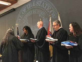June 25, 2019 ceremony where four Dakota Communities gave tribal flags to Hennepin and Scott County District Courts.