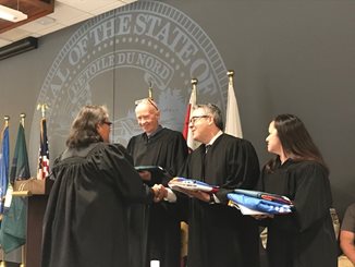 June 25, 2019 ceremony where four Dakota Communities gave tribal flags to Hennepin and Scott County District Courts.